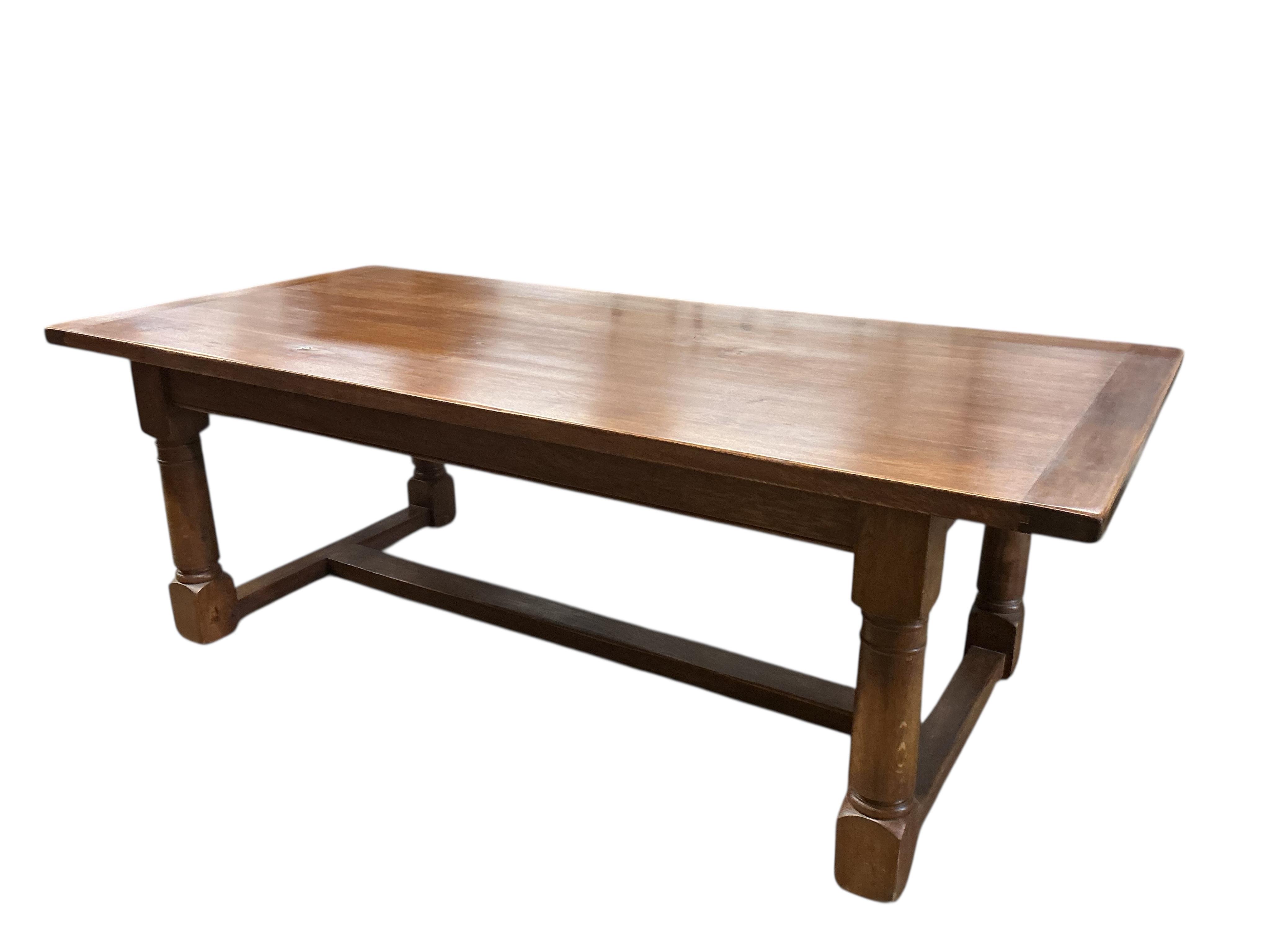An 18th century style rectangular oak refectory dining table, width 229cm, depth 107cm, height 78cm